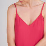 Bright pink jumpsuit sewn using the I AM Valérie sewing pattern