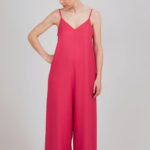 Bright pink jumpsuit sewn using the I AM Valérie sewing pattern