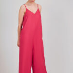 Bright pink jumpsuit sewn using the I AM Valérie sewing pattern